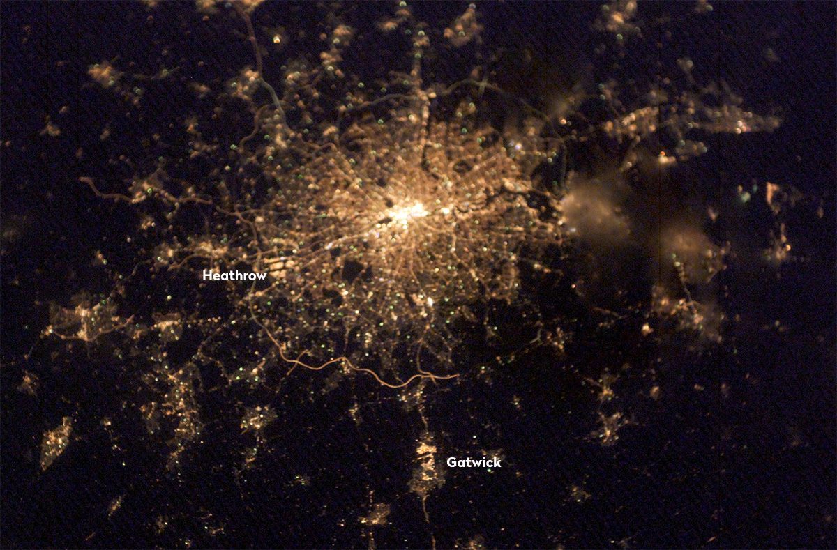 London's Heathrow and Gatwick airports, seen at night from the International Space Station. Earth's biggest airports could reveal our location to an advanced alien species. Credit: NASA