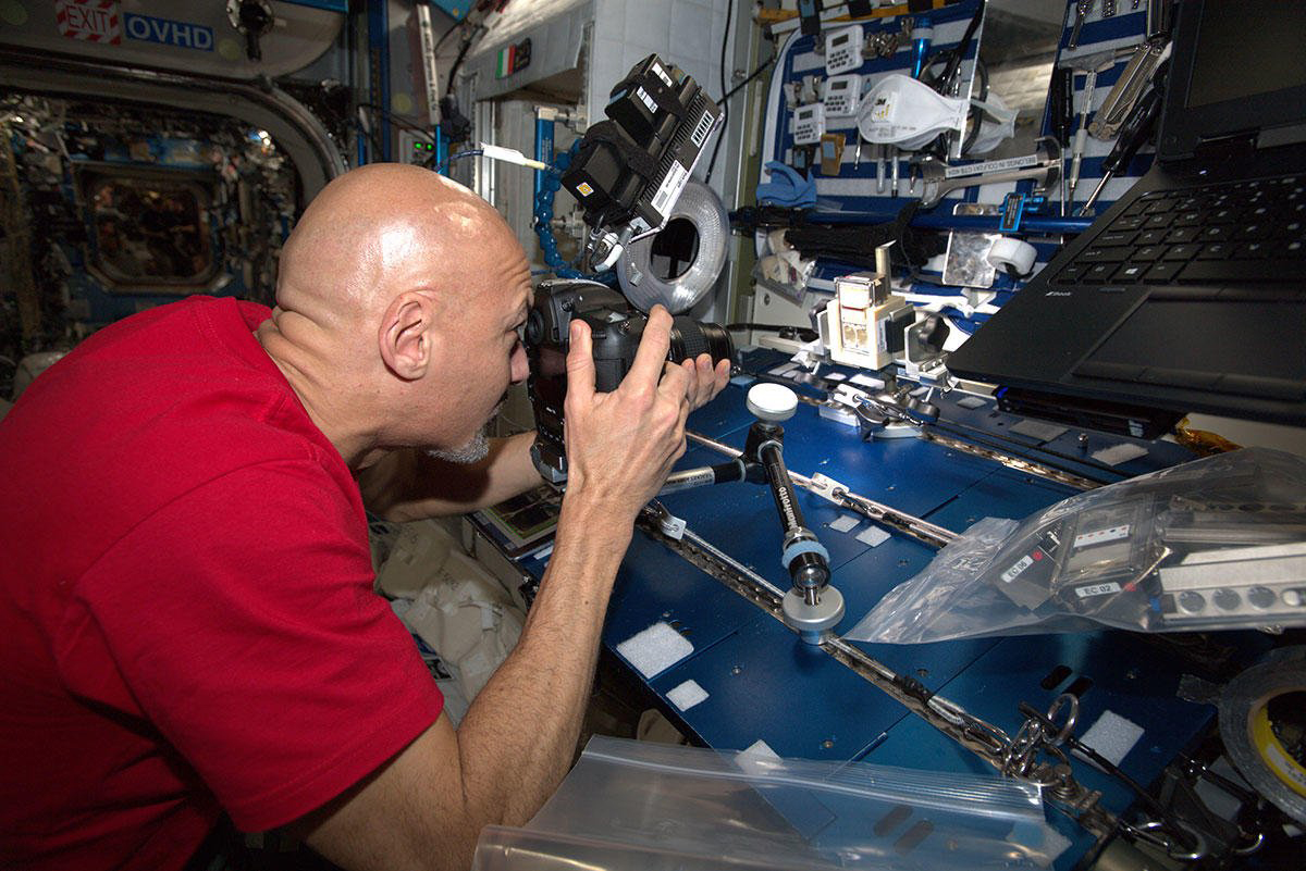 ESA astronaut Luca Parmitano photographing the BioRock experiment on the International Space Station. Credit: ESA/NASA