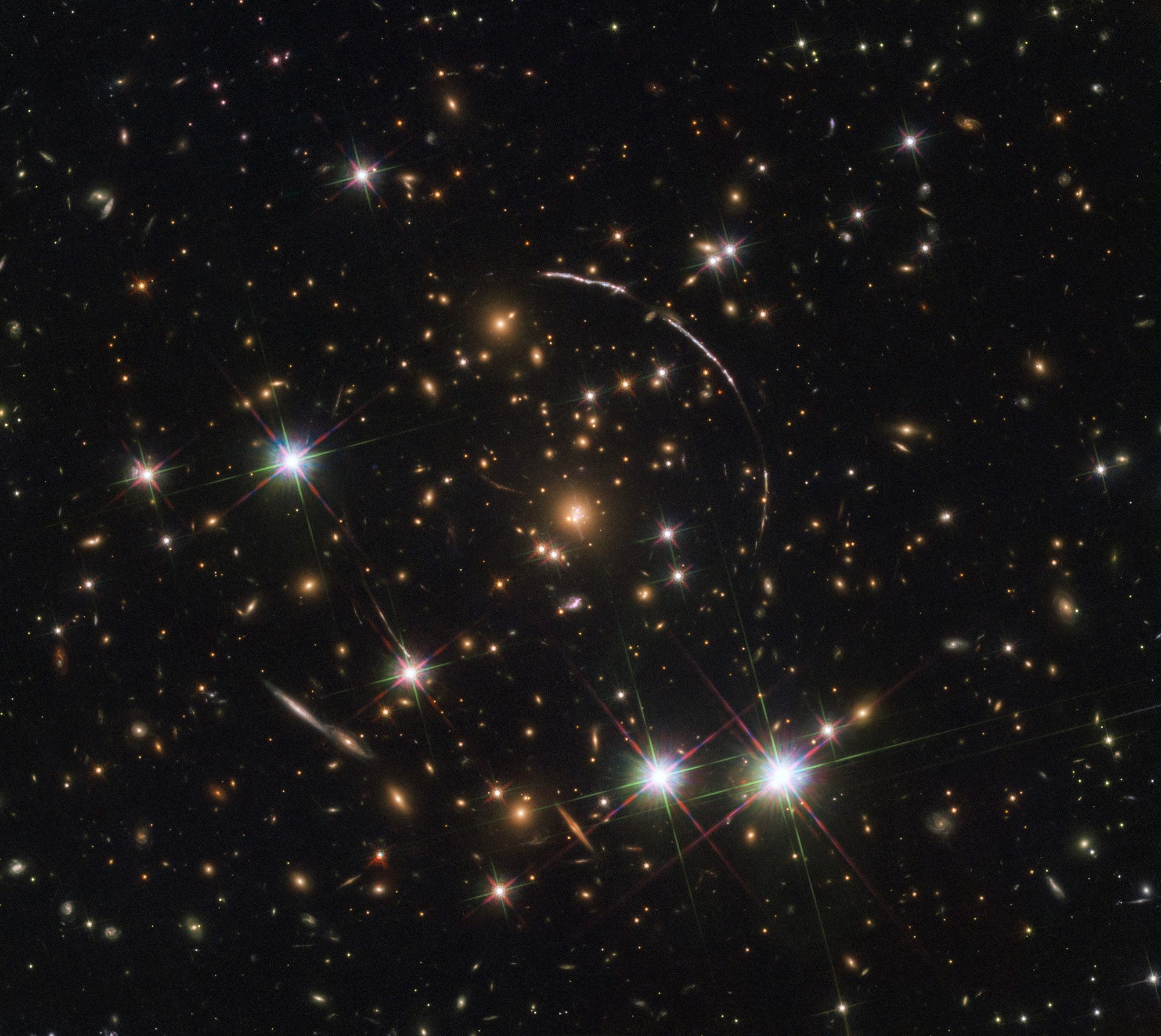 This is a good example of gravitational lensing, as the Sunburst Arc galaxy seen in this image is visible at least 12 times within the four arcs. Credit: NASA, ESA, K. Sharon (Tel Aviv University) and E. Ofek (Caltech) This Hubble image shows gravitational lensing in action as the light from a distant quasar is bent and multiplied by the gravity of a cluster of galaxies in front of it. Credit: ESA/Hubble, NASA, Rivera-Thorsen et al.