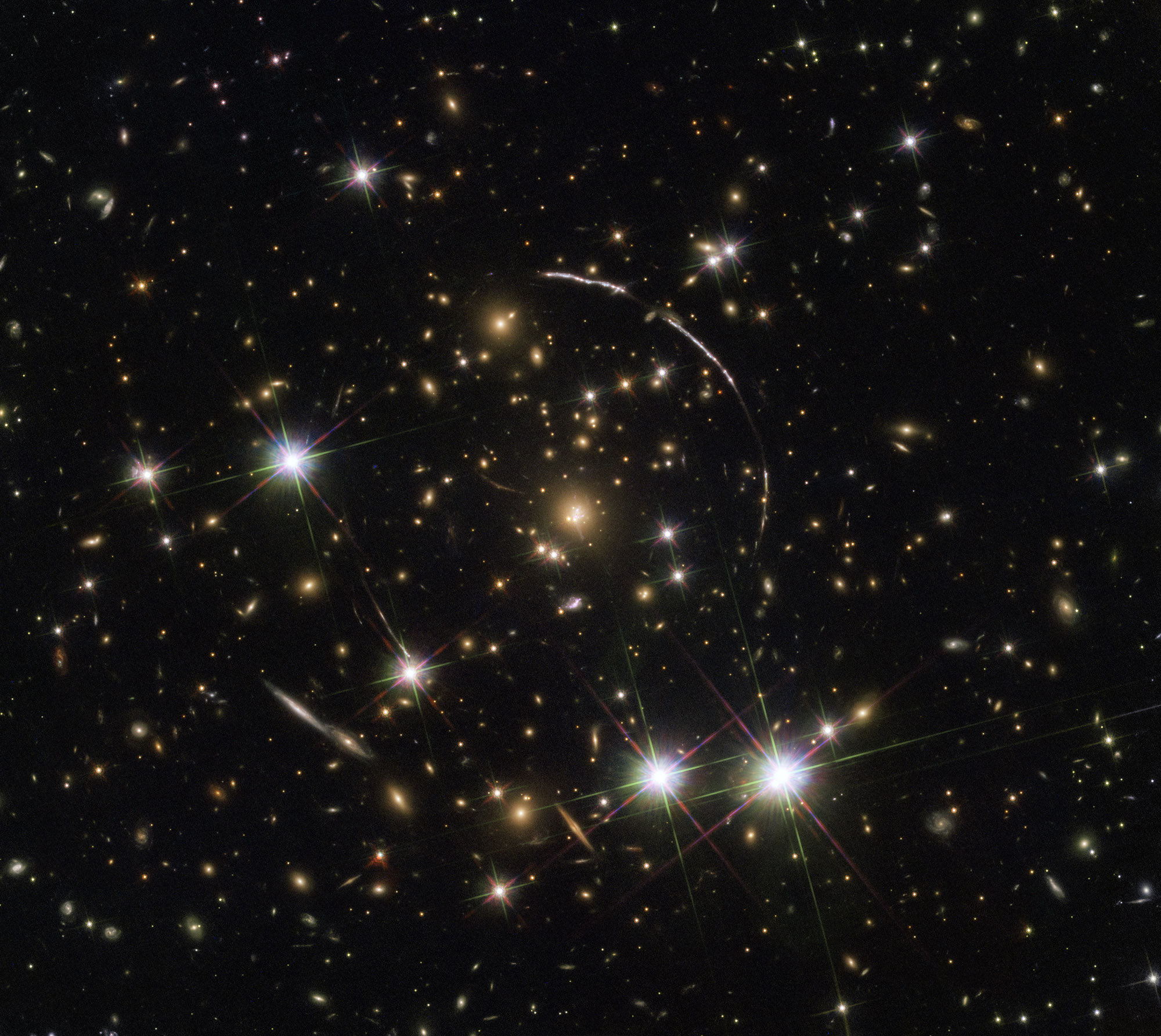 This is a good example of gravitational lensing, as the Sunburst Arc galaxy seen in this image is visible at least 12 times within the four arcs. Credit: NASA, ESA, K. Sharon (Tel Aviv University) and E. Ofek (Caltech) This Hubble image shows gravitational lensing in action as the light from a distant quasar is bent and multiplied by the gravity of a cluster of galaxies in front of it. Credit: ESA/Hubble, NASA, Rivera-Thorsen et al.