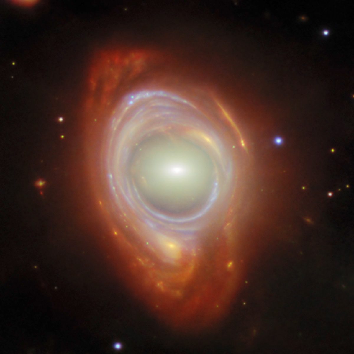Einstein ring produced by a light from a distant galaxy warping around a closer elliptical galaxy, as seen by the James Webb Space Telescope. Credit: ESA/Webb, NASA & CSA, G. Mahler. Acknowledgement: M. A. McDonald