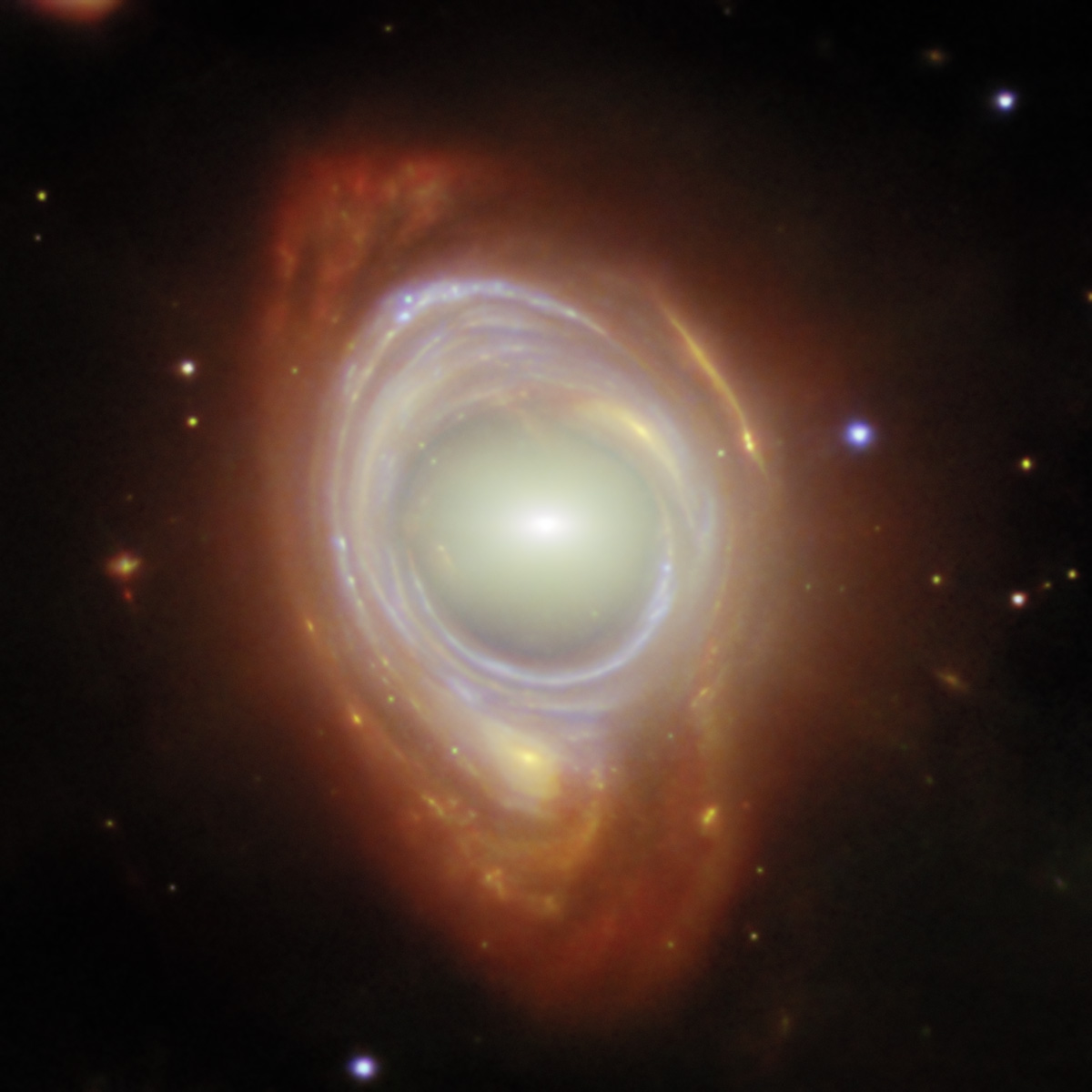 Einstein ring produced by a light from a distant galaxy warping around a closer elliptical galaxy, as seen by the James Webb Space Telescope. Credit: ESA/Webb, NASA & CSA, G. Mahler. Acknowledgement: M. A. McDonald