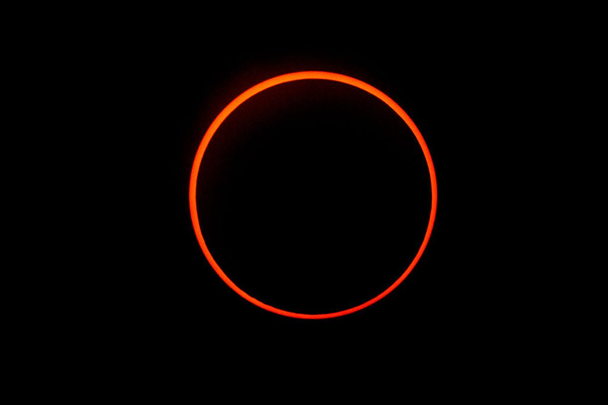 During an annular solar eclipse, a thin ring of sunlight is seen around the silhouette of the Moon. Photo by LUIS ACOSTA/AFP via Getty Images