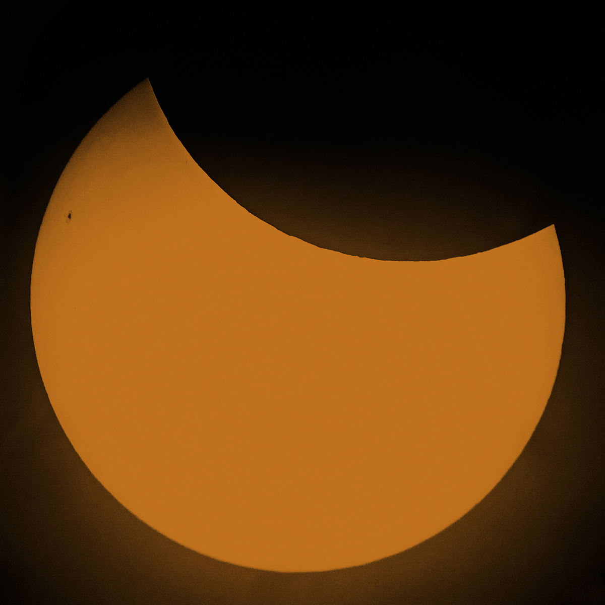 Partial solar eclipse, 29 March 2025, 11:05 UTC Matey and James, Ryetop Park, Rainham, Kent, UK. Equipment: Samsung Galaxy phone through Celestron NexStar 127SLT, 47x magnification. Exposure: f/1.8, 1/250 sec, ISO-100, colourised. Software: Photoshop