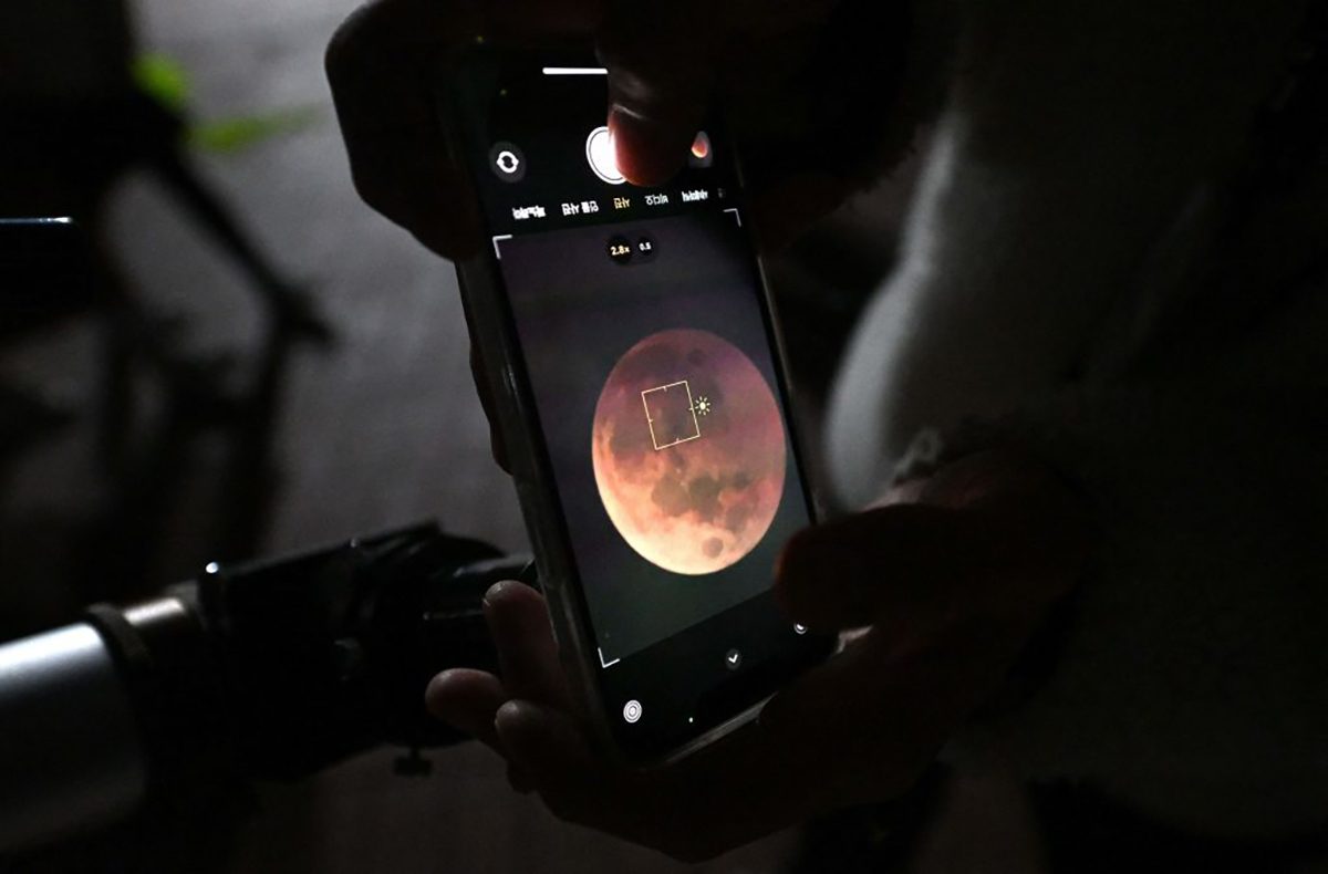 Lock onto the Moon, then use the 'Sun' symbol to adjust the brightness. Photo by JUNG YEON-JE/AFP via Getty Images