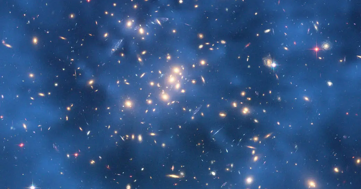 We can only see dark matter from its effect on stars and galaxies. Here, astronomers used the images of galaxies distorted by gravitational lensing to map out the dark matter, shown in blue. Credit: NASA, ESA, M. Jee and H. Ford (Johns Hopkins University)