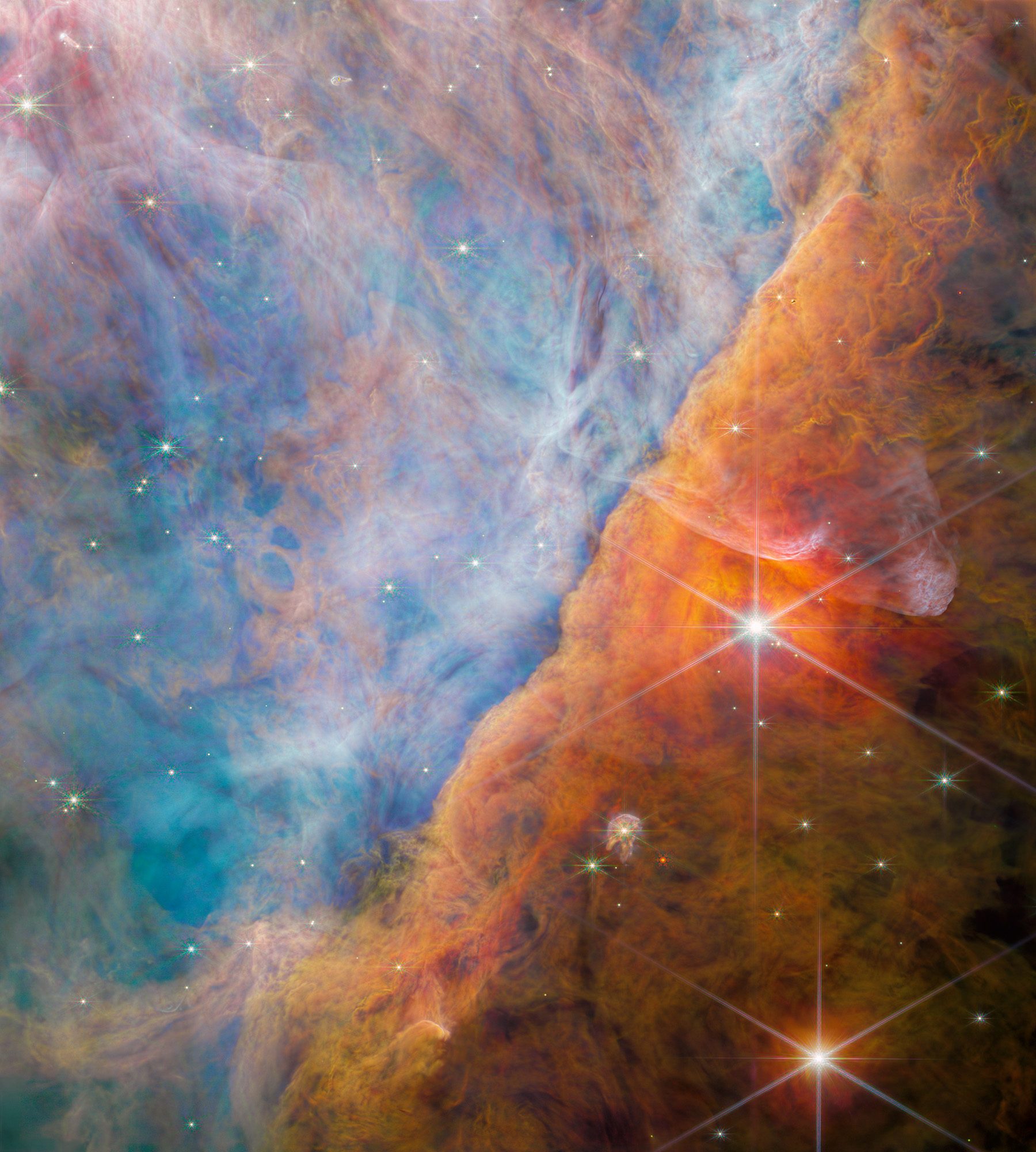 Image captured by Webb Telescope’s NIRCam (Near-Infrared Camera) showing a part of the Orion Nebula known as the Orion Bar. Credit: ESA/Webb, NASA, CSA, M. Zamani (ESA/Webb), PDRs4ALL ERS Team