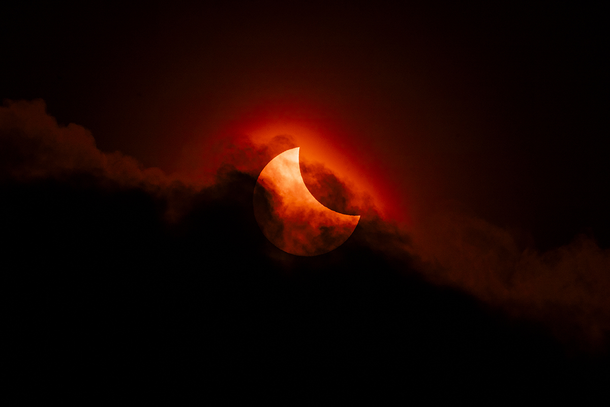 Moody Partial Solar Eclipse © James McBeath (UK), Our Sun category. Taken with a Sony ILCE-7 camera, Canon EF 300 mm USM lens with 2x teleconverter, Sky-Watcher Star Adventurer Mini mount, Pig Iron 720-nm R-72 Infrared filter, 600 mm f/18, ISO 100, 1/3,200-second exposure. Location: Leeds, West Yorkshire, England, 29 March 2025