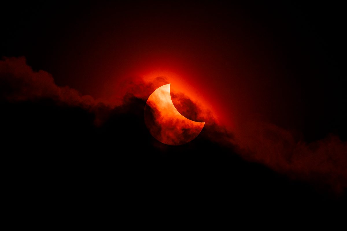 Moody Partial Solar Eclipse © James McBeath (UK), Our Sun category. Taken with a Sony ILCE-7 camera, Canon EF 300 mm USM lens with 2x teleconverter, Sky-Watcher Star Adventurer Mini mount, Pig Iron 720-nm R-72 Infrared filter, 600 mm f/18, ISO 100, 1/3,200-second exposure. Location: Leeds, West Yorkshire, England, 29 March 2025
