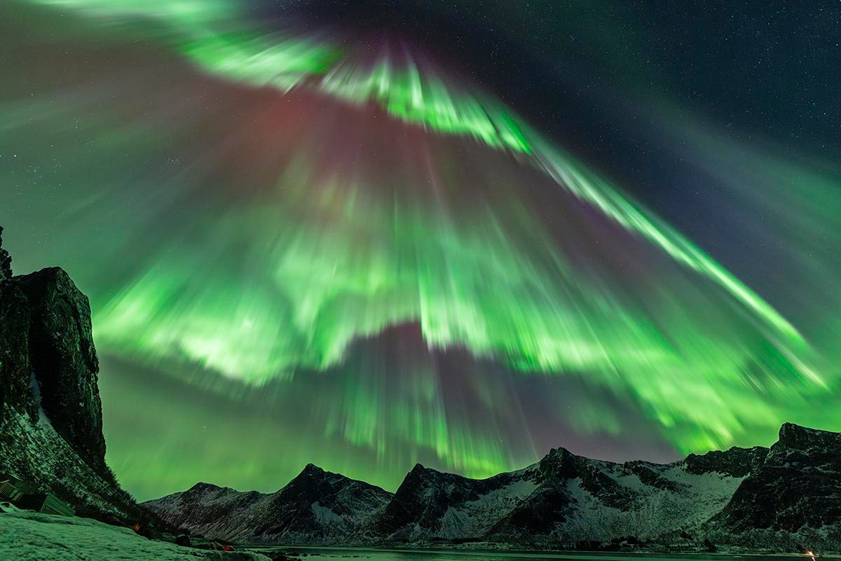 An Auroral Deluge © Julien Cadena (France), Aurorae category. Taken with a Sony Alpha 7 IV camera, 14 mm f/2.8, ISO 3200, 1-second exposure. Location: Lyngen, Troms, Norway, 20 January 2026