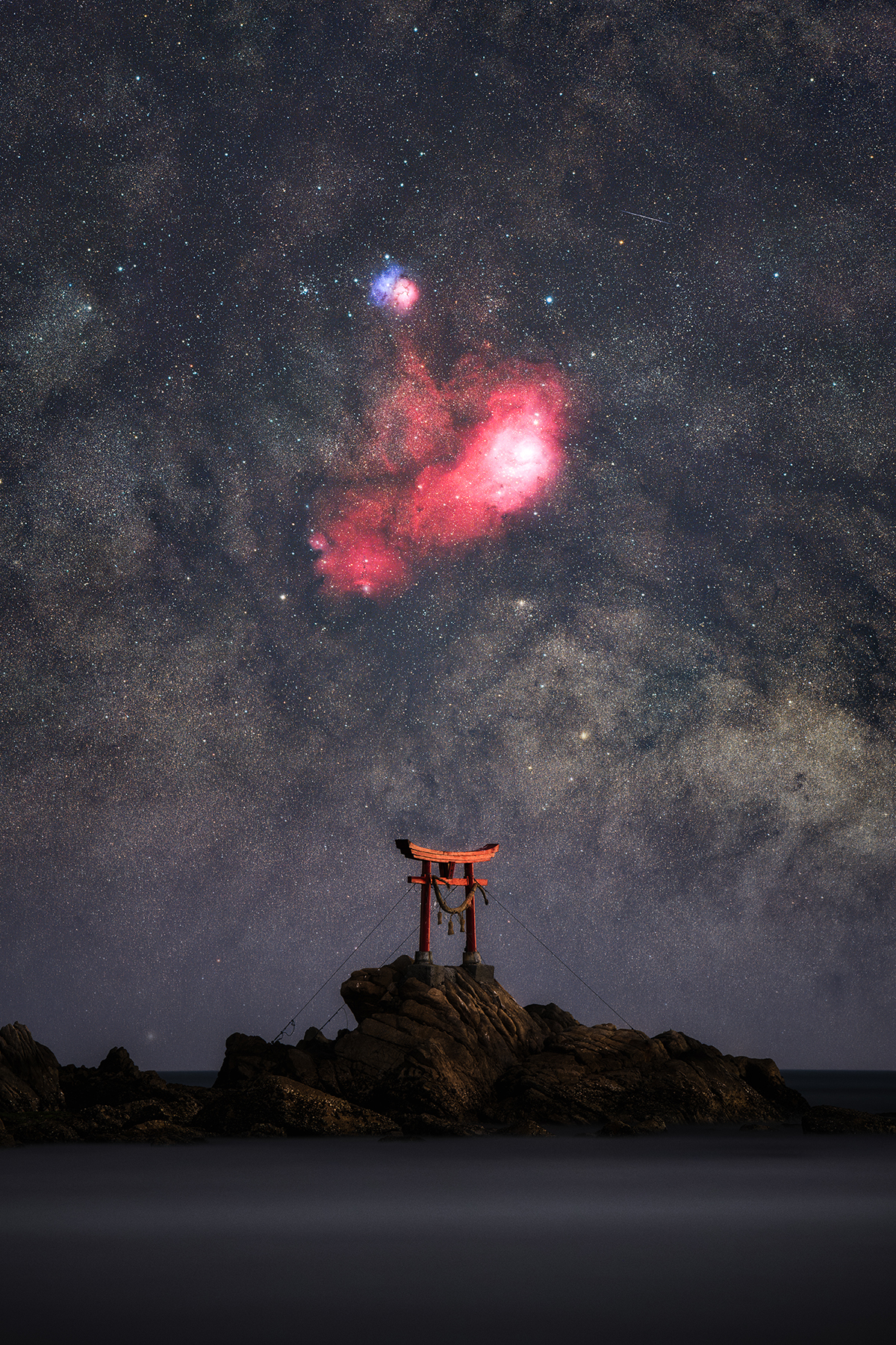 The Celestial Gate © Yoshiki Abe (Japan), Skyscapes category. Taken with a Sony ILCE-7RM5 camera, 200 mm, Foreground: f/5.6, ISO 320, 240-second exposure; Sky: f/4.0, ISO 3200, 34 x 60-second exposures; H-alpha: f/2.8, ISO 6400, 28 x 120-second exposures. Location: Kitsuki, Ōita Prefecture, Japan, 22 February 2026