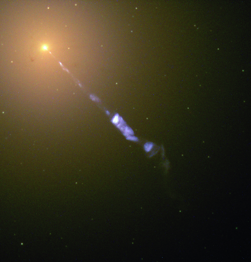 February 1998 Streaming from the centre of the galaxy M87 like the beam of a lighthouse is a black-hole-powered jet of electrons and other sub-atomic particles travelling at nearly the speed of light. The blue of the jet contrasts with the yellow glow from the combined light of billions of unseen stars that make up the galaxy, which lies 50 million lightyears away.
