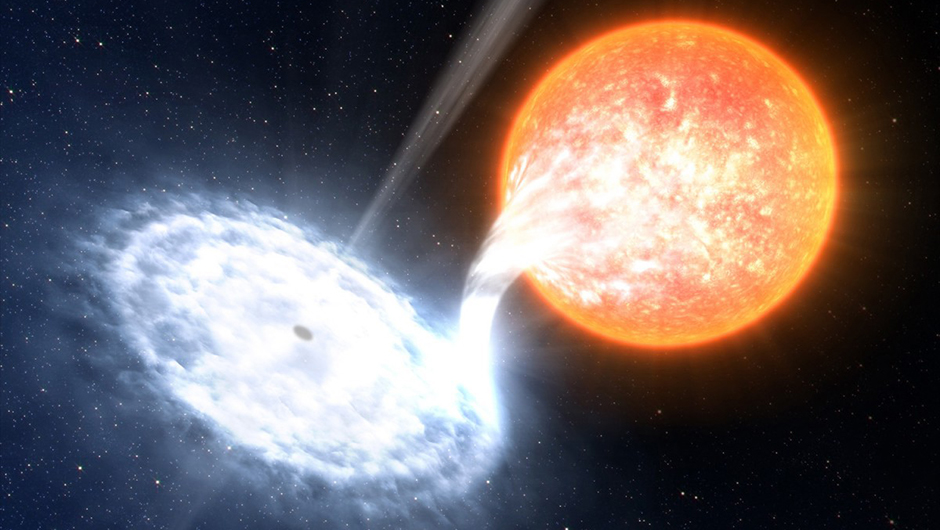 Radiation emanating from accretion disks as a black hole strips a nearby star of its matertail is one way we can infer that a black hole exists. Credit: ESO/L. Calçada