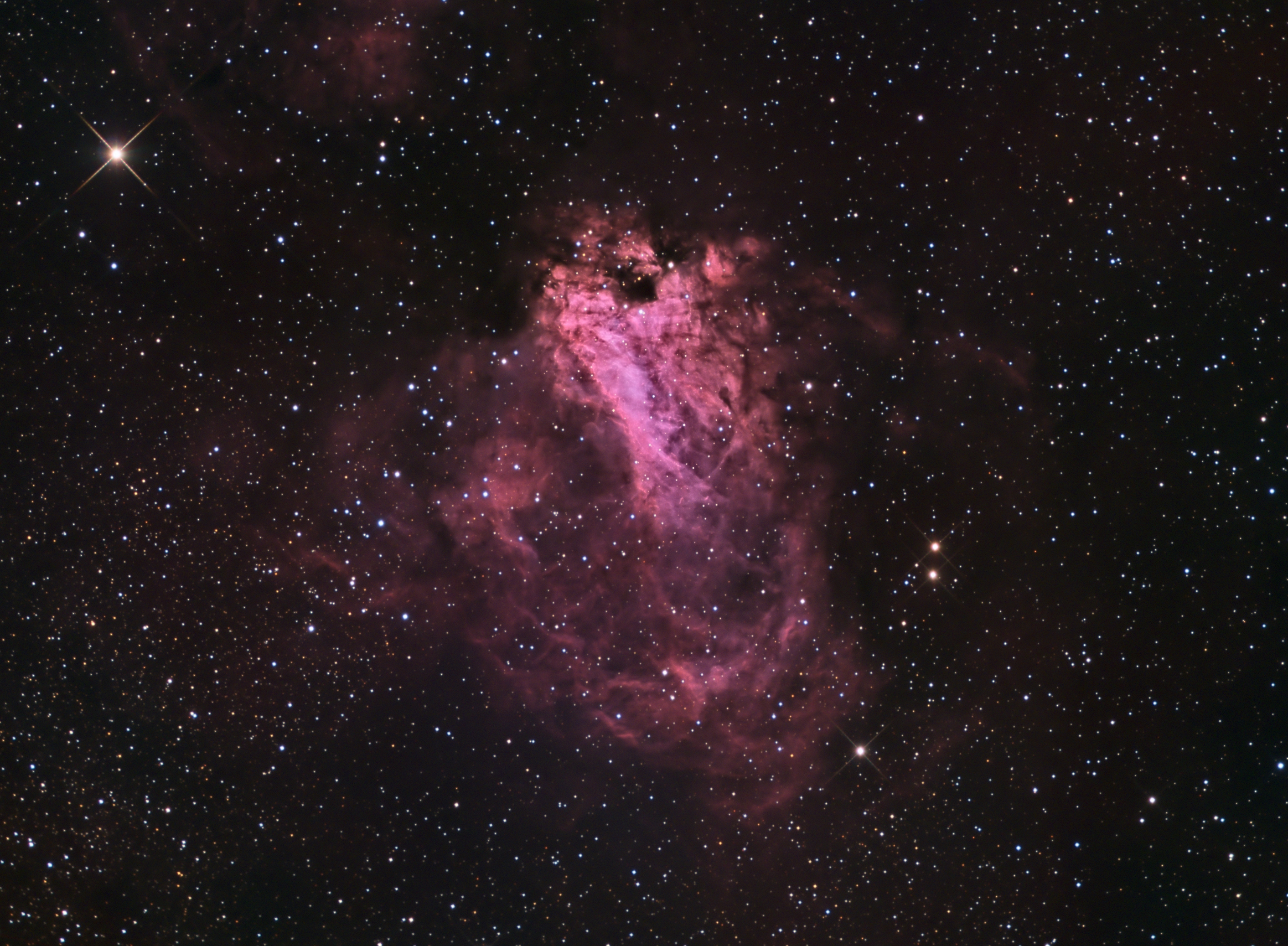 M17, The Swan Nebula by Ron Brecher, Guelph, Ontario, Canada. Equipment: SBIG STL-11000M, Baader Ha, R, G, B filters, 10" f/6.8 ASA astrograph, Paramount MX, QHY5 guide, 80 mm f/6 Stellar-Vue refractor.