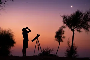 A man observing the night sky through binoculars. Credit: Bright Stars / Getty Images A man observing the night sky through binoculars. Credit: Bright Stars / Getty Images
