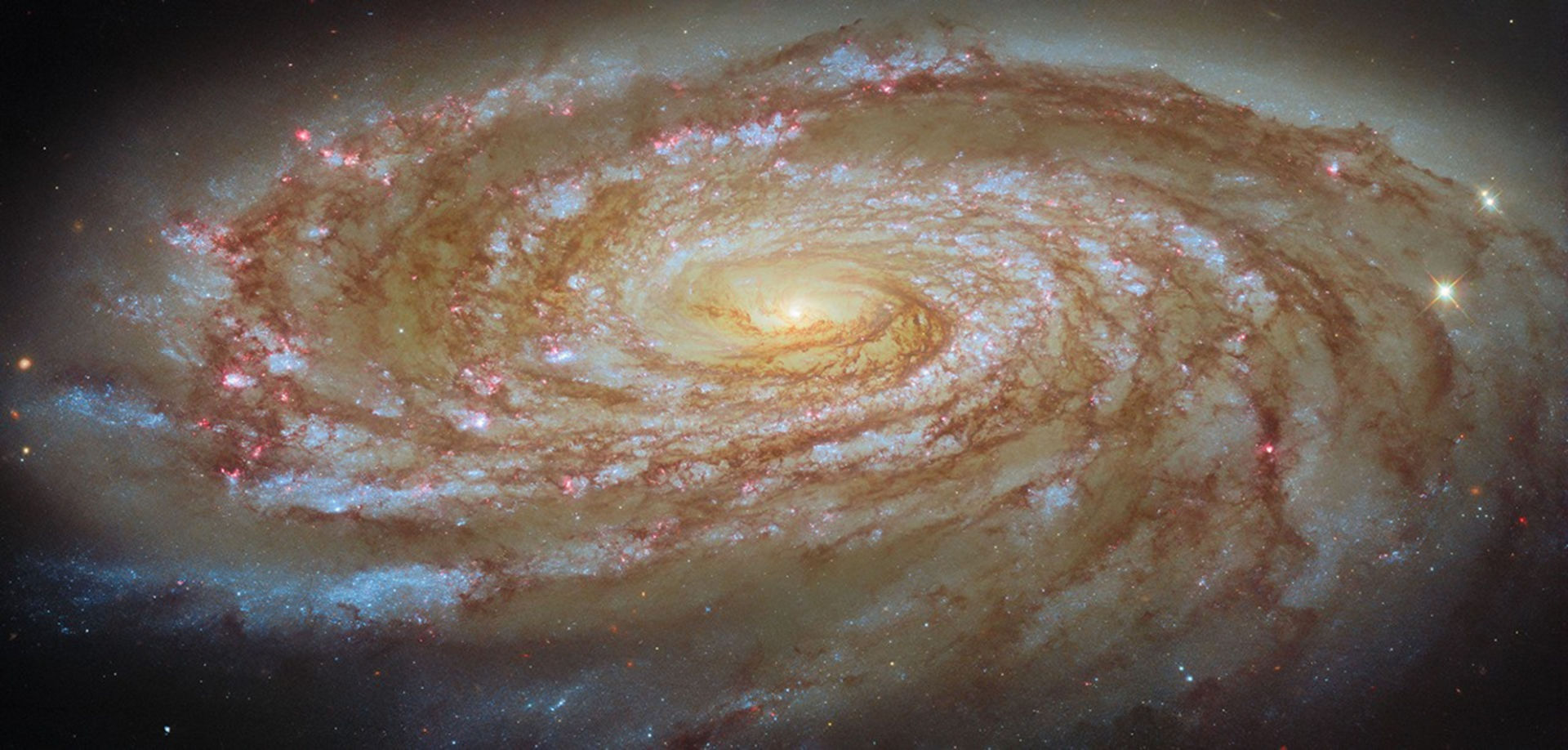 Why don't spiral galaxies tear themselves apart? Some invisible force is holding them together. Credit: ESA/Hubble & NASA, D. Thilker
