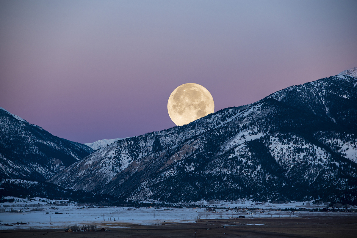 The 2026 Cold Moon will rise in the east as the Sun is setting in the west on Christmas Eve. Credit: Brad McGinley Photography / Getty Images