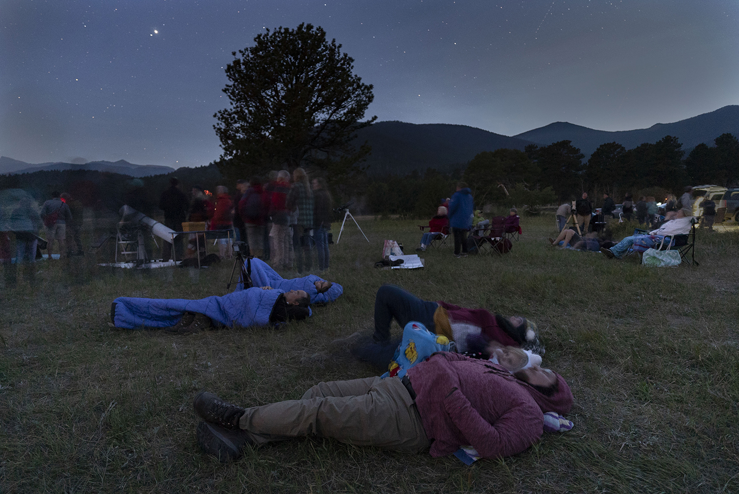 Lying or reclining is a great way to observe meteor showers without getting cramp in your neck. Here, meteor watchers await the Perseid peak of 12 August 2018 at the Rocky Mountain National Park in the US. Credit: STAN HONDA / AFP via Getty Images. Lying or reclining is a great way to observe meteor showers without getting cramp in your neck. Here, meteor watchers await the Perseid peak of 12 August 2018 at the Rocky Mountain National Park in the US. Credit: STAN HONDA / AFP via Getty Images.