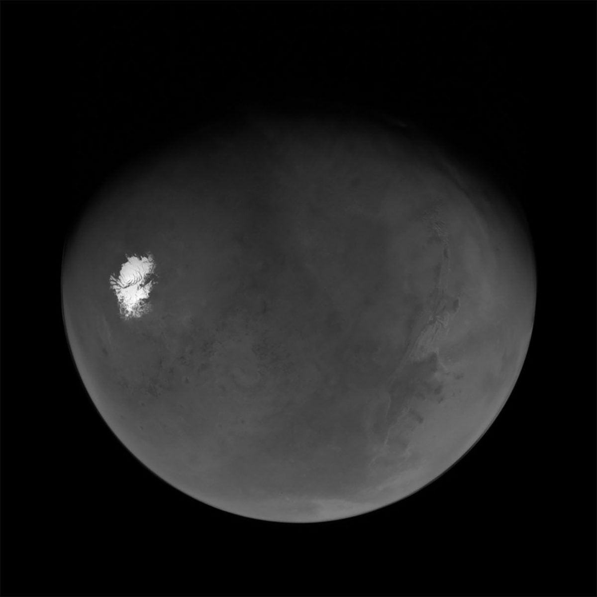 A nearly-full Mars seen by NASA’s Psyche spacecraft shortly after its closest approach to the planet on 15 May 2026. The view extends from the south polar cap to the Valles Marineris canyon system and beyond. Credit: NASA/JPL-Caltech/ASU