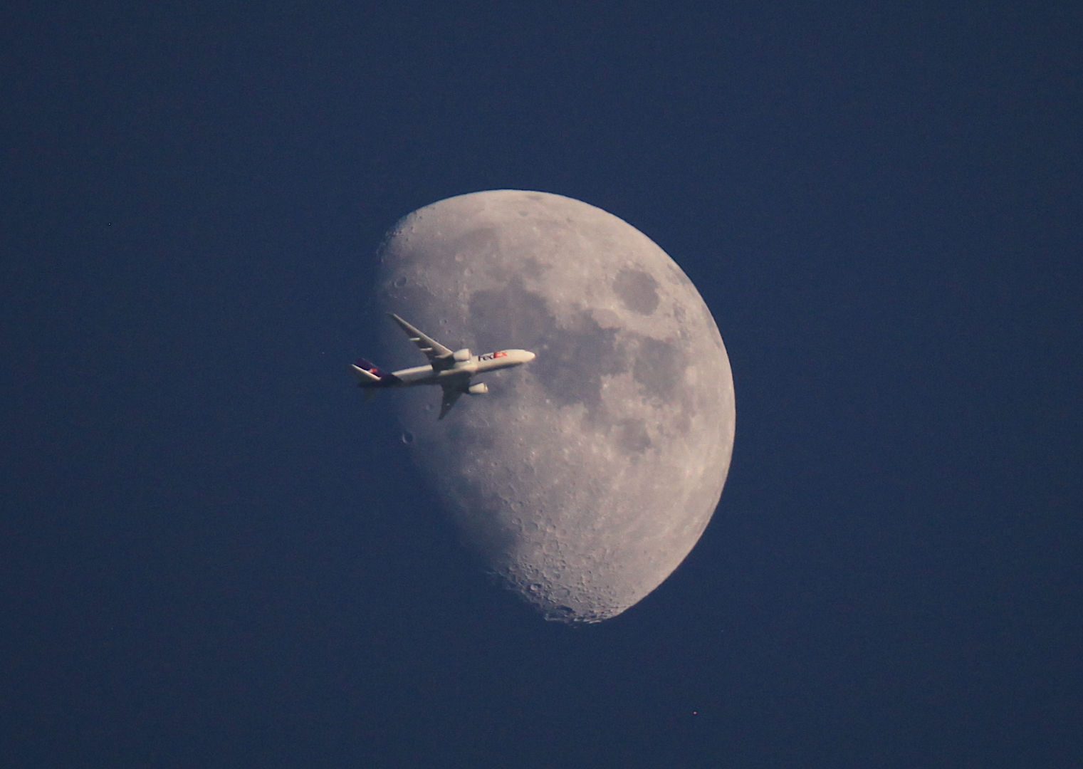 FedEx lunar transit Paul Gavey, Guernsey, UK, 25 May 2026 Equipment: Canon EOS 5D Mk II camera, Canon 200-400mm lens, shot handheld