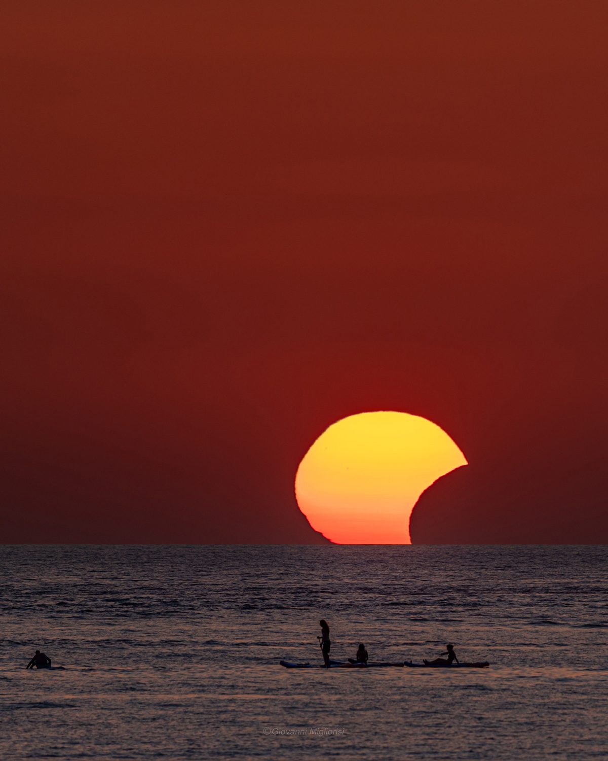 The partial solar eclipse at sunset over the Mediterranean Sea, captured by Giovanni Migliorisi, Punta Braccetto, Sicily, Italy, 12 August 2026, 19:54 local time. "This is one of a series of shots taken when the Sun was more than 21% covered. The entire partial eclipse lasted a total of 18 minutes," says Giovanni. @gio.miglio_photography Equipment: Nikon D780 camera, Tamron 150-600mm lens at 600 mm Exposure: 1/320s, f/7, ISO 100 Software: Photoshop