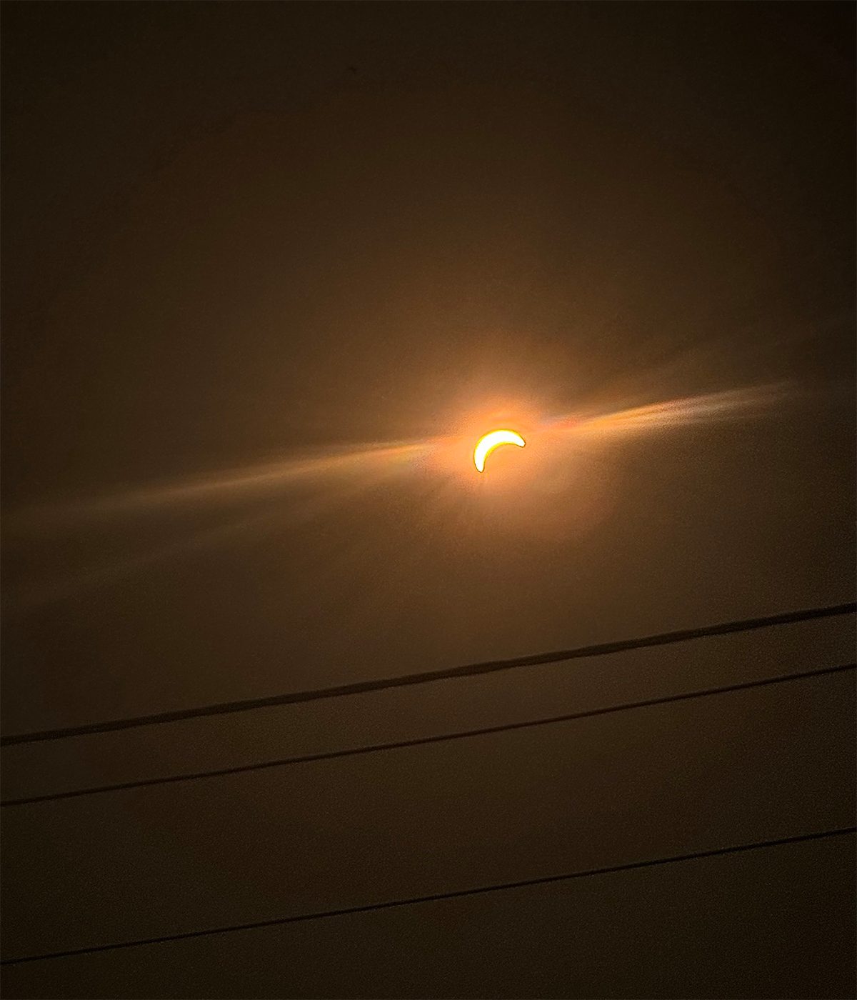 The partial solar eclipse captured by Jessica Evans on 12 August 2026 from Llanfrechfa, South Wales, UK. Equipment: iPhone 15 Pro Max