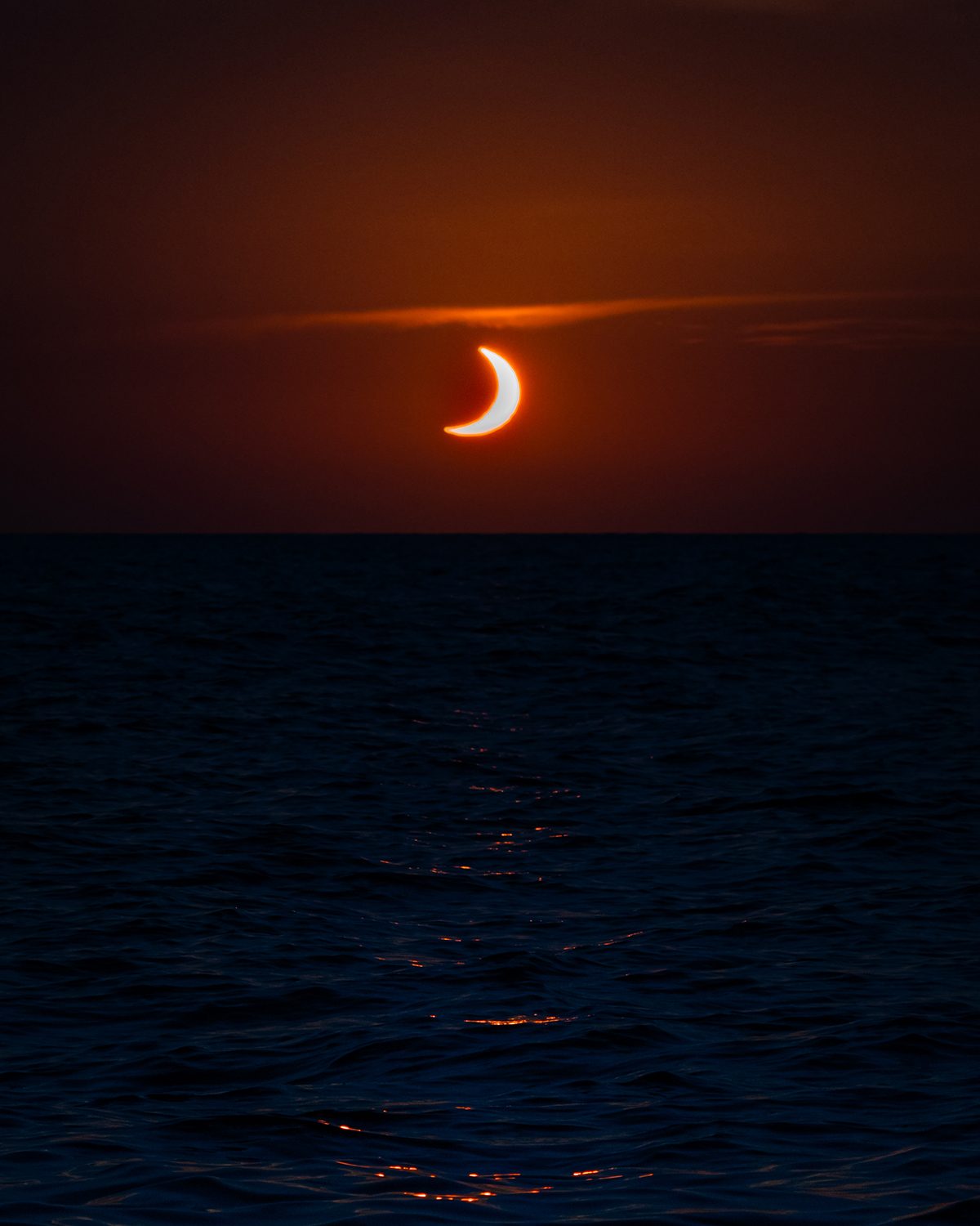 A sunset solar eclipse off the coast of Mallorca, Spain, captured by James Woods, 12 August 2026. Equipment: Sony A6600 camera, Sony 70-350mm G lens Exposure: 1/1000s, f/8, ISO 640 Software: Lightroom Mobile