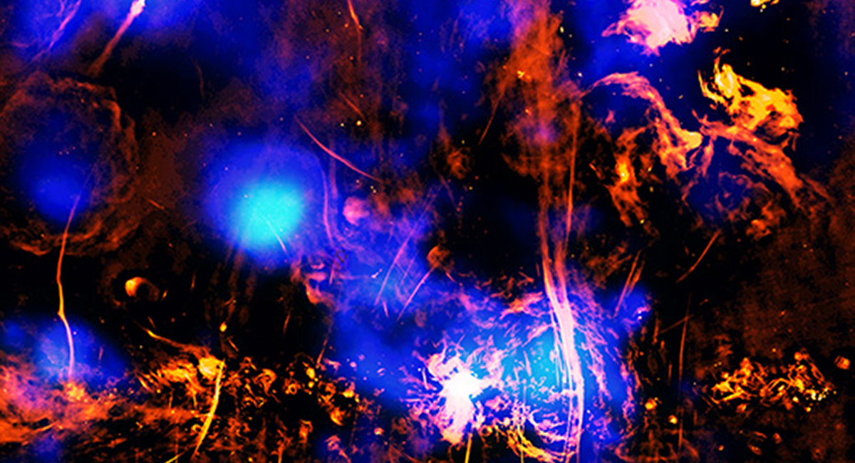 Image of the region near the centre of the Milky Way galaxy showing the supermassive black hole Sagittarius A*, a chimney and a vent funnelling cosmic material outwards. Captured by the Chandra X-Ray Observatory and the MeerKAT telescope. Credit: X-ray: NASA/CXC/Univ. of Chicago/S.C. Mackey et al.; Radio: NRF/SARAO/MeerKAT; Image Processing: NASA/CXC/SAO/N. Wolk