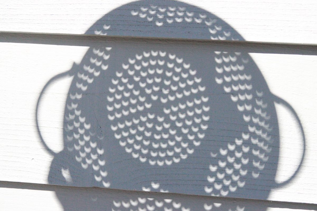 The 14 October 2023 annular solar eclipse captured through a kitchen colander by Donald Samuels from Colorado, USA.