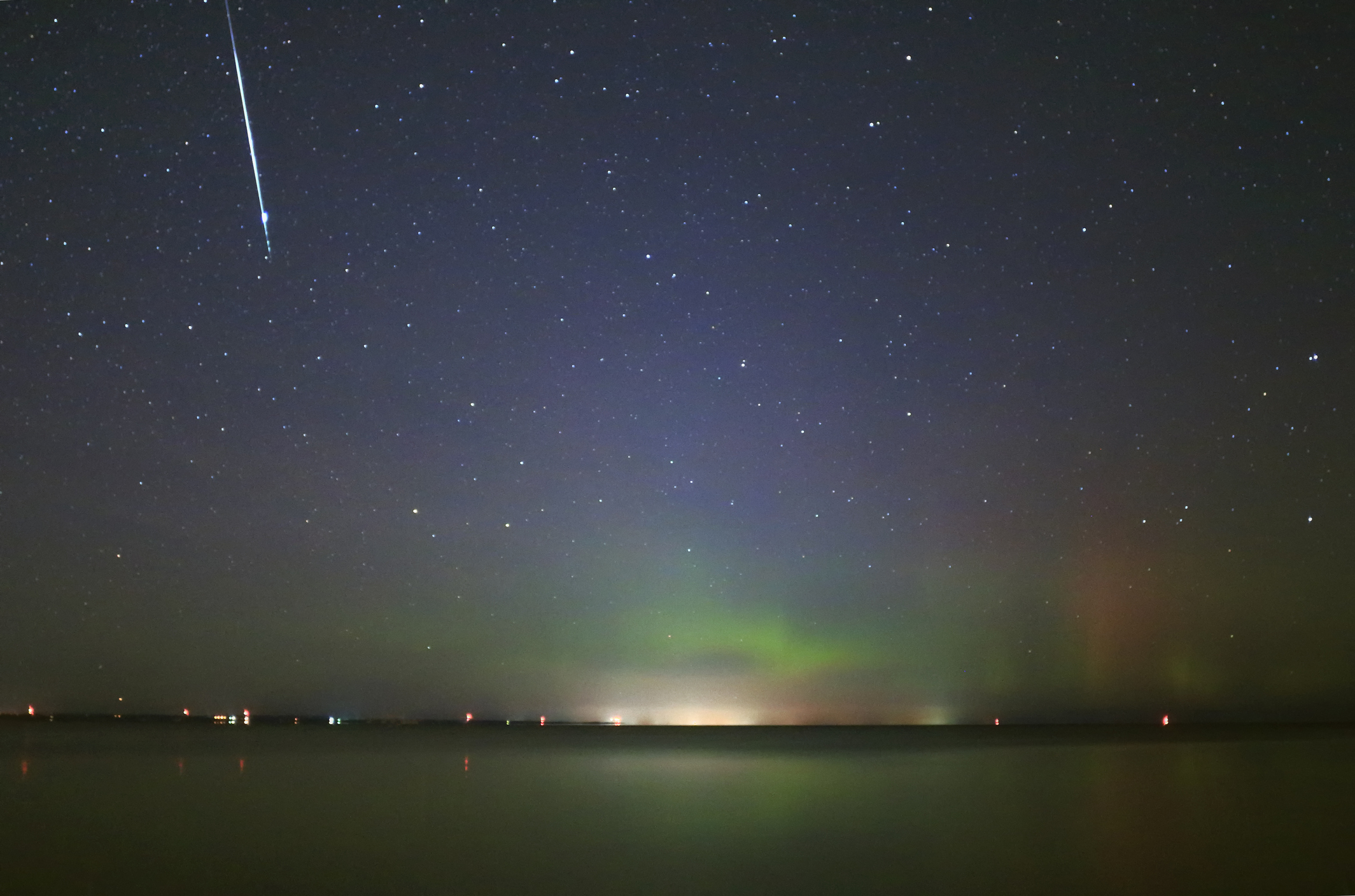 Taurid meteor over Lake Simcoe, Ontario, Canada. Credit: Orchidpoet / Getty Images