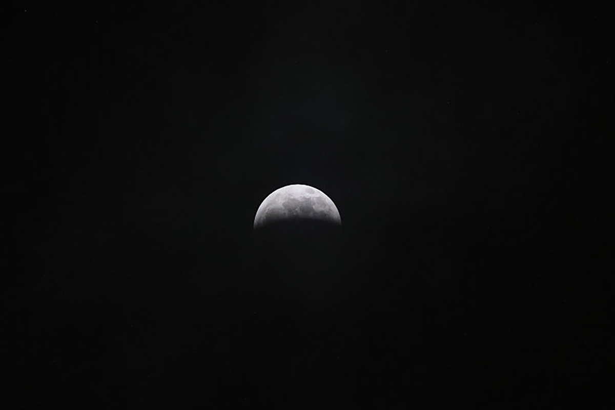 The partial lunar eclipse seen late on 27 August 2026 over Quito, Ecuador. Photo by Franklin Jacome/Agencia Press South/Getty Images