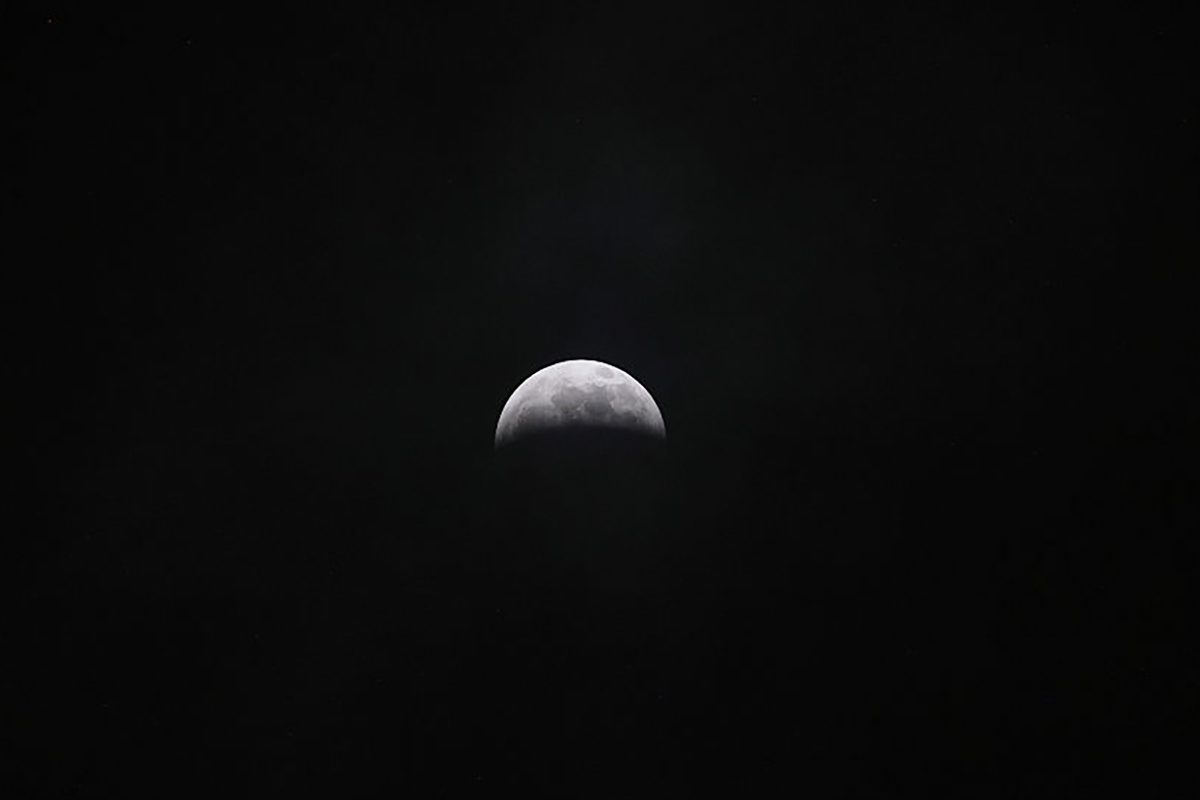 The partial lunar eclipse seen late on 27 August 2026 over Quito, Ecuador. Photo by Franklin Jacome/Agencia Press South/Getty Images