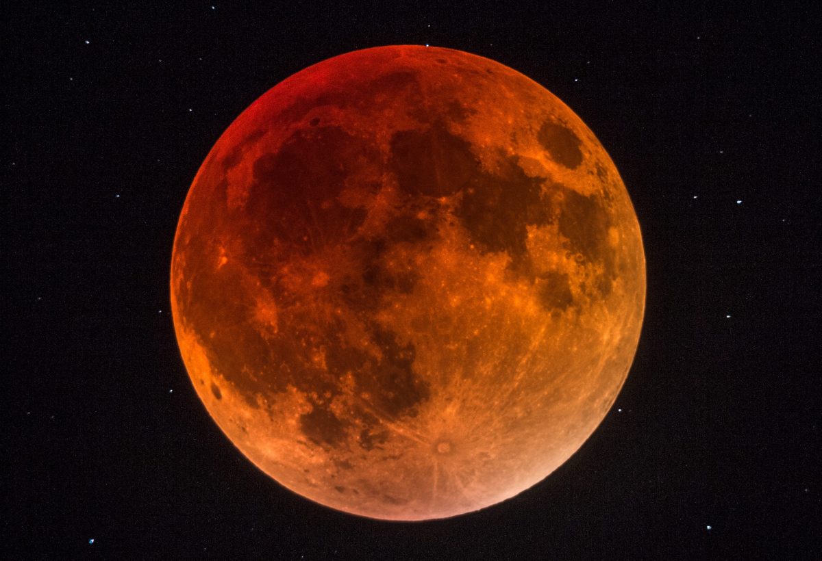 A rusty red lunar eclipse photographed by William Doyen, Brittany, France, 28 September 2015.