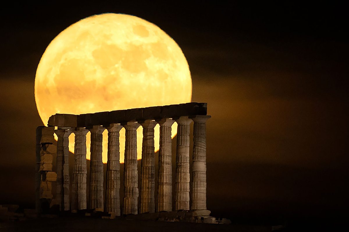 The Blue Moon rises over the Temple of Poseidon on Cape Sounion near Athens, Greece, 31 May 2026. Photo by Costas Baltas/Anadolu via Getty Images