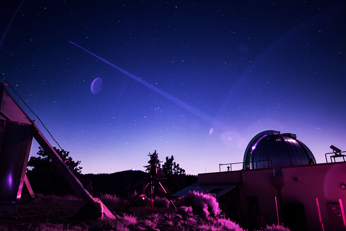 Infrared image showing the Optical Communications Telescope Laboratory at NASA JPL's Table Mountain Facility beaming a laser beacon to the DSOC flight laser transceiver aboard NASA's Psyche spacecraft. Credit: NASA/JPL-Caltech