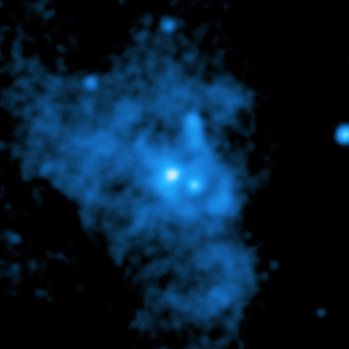 A composite image showing evidence for a wind blowing away from Sagittarius A* the supermassive black hole at the centre of our galaxy, in Chandra X-ray data. X-ray: NASA/CXC/Northwestern Univ./M. Gorski; Image processing: NASA/CXC/SAO/K. Arcand and P. Edmonds
