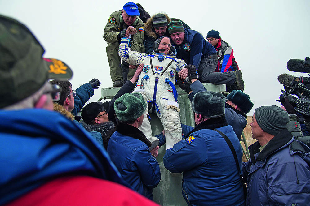 Scott Kelly is pulled out of the Soyuz by the Russian rescue forces after a year in space.