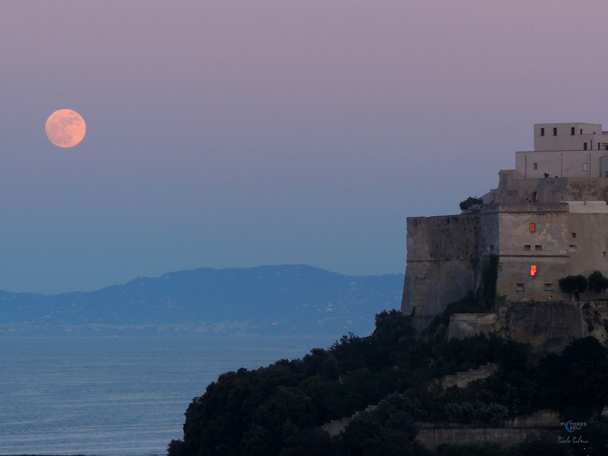The almost-full Moon captured by Paolo Palma next to the Castello Aragonese di Baia, Bacoli, Italy 30 May 2026. Equipment: Nikon Coolpix P510 camera