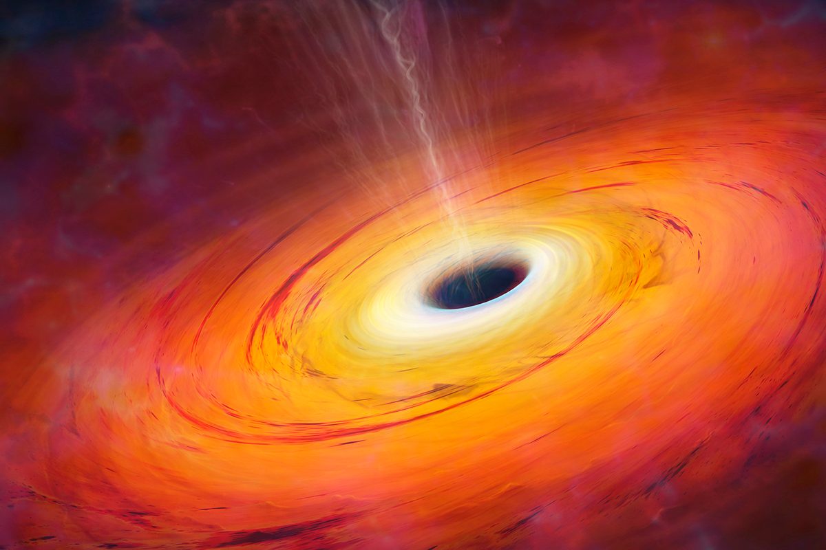 Artist's impression of a supermassive black hole at the centre of a galaxy. Credit: Science Photo Library - MARK GARLICK / Getty Images
