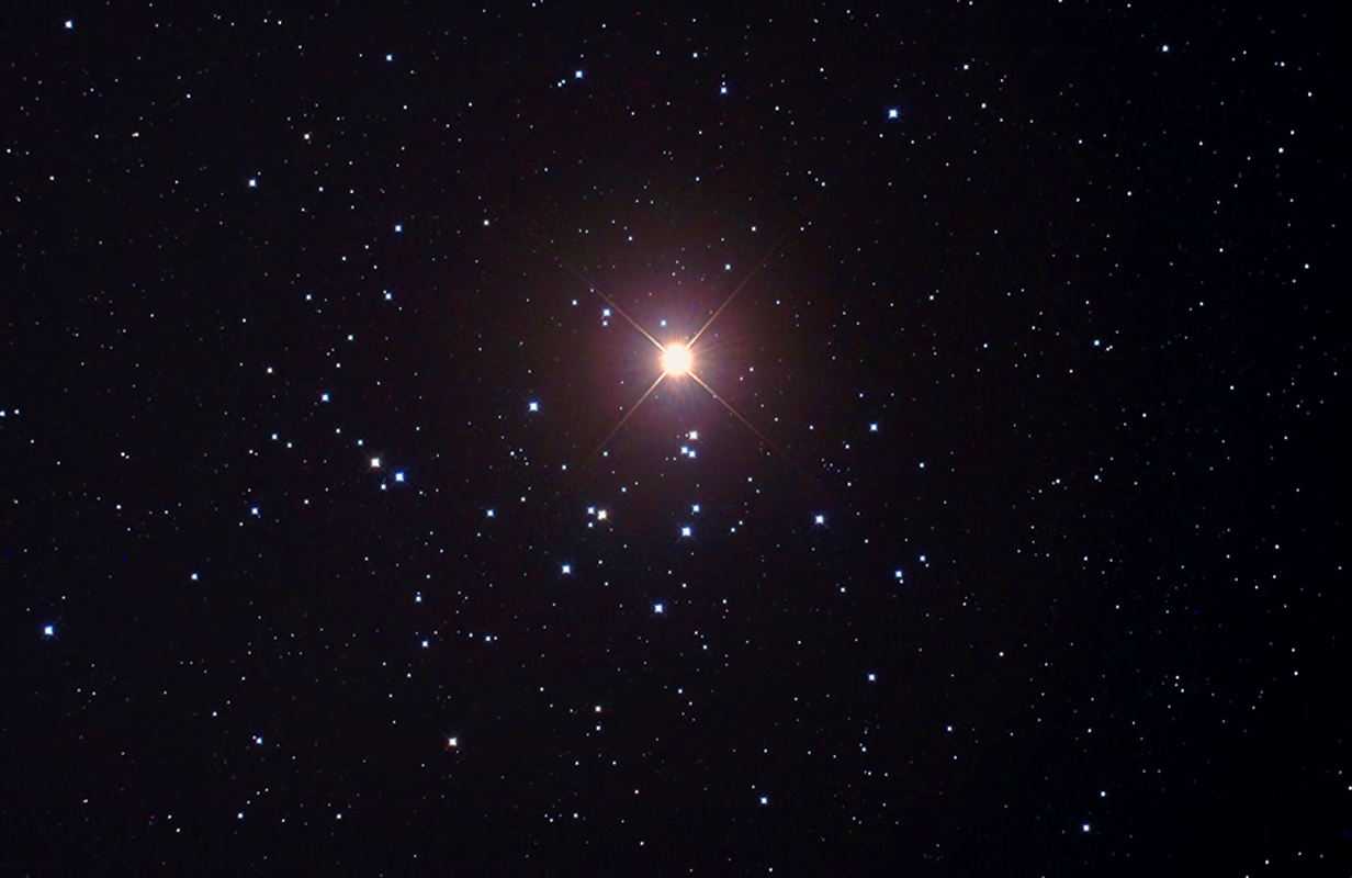 Mars passing across the Beehive Cluster in October 2011, imaged through a f/3.3 reflector. Credit: Pete Lawrence