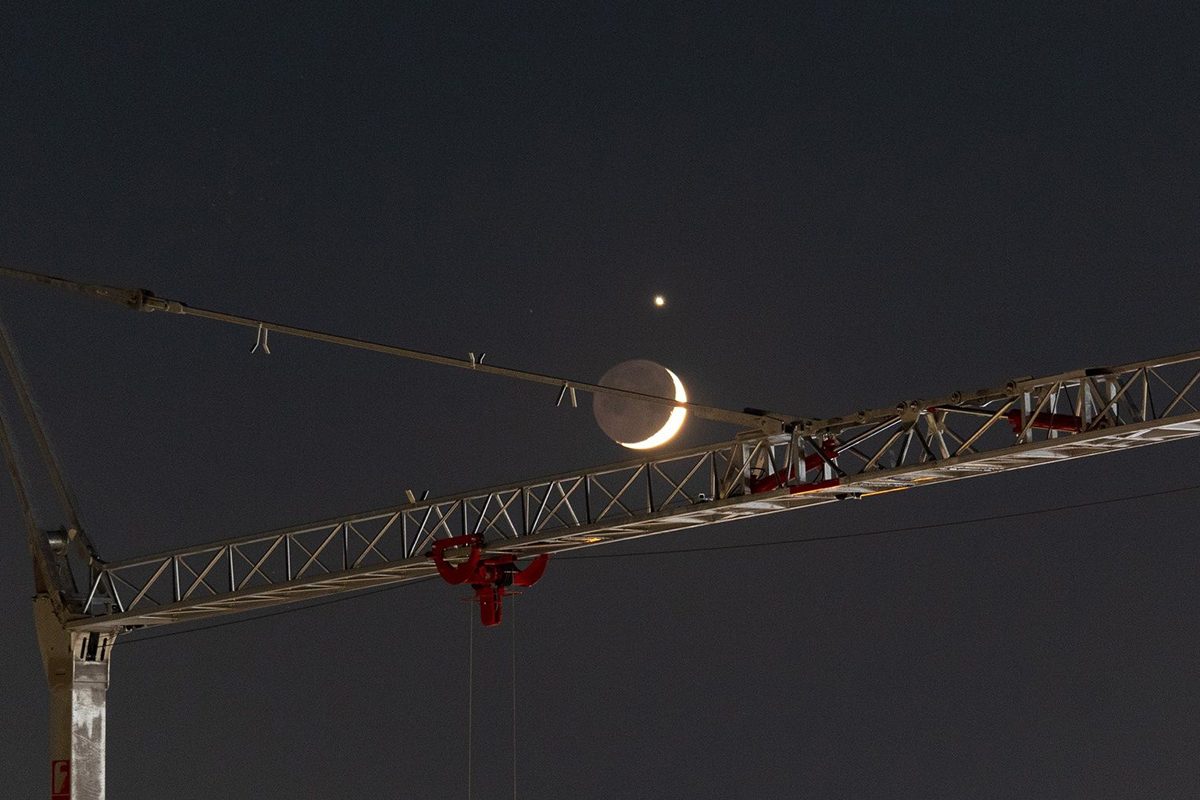Paolo Barrella sent us this image of Venus and the crescent Moon captured from Scandicci, Florence, Italy, 17 June 2026. 23:02 local time. Paolo says: "This image shows a beautiful crescent Moon — with Earthshine clearly visible on its dark limb — in close conjunction with the bright planet Venus, framed by the lattice structure of a construction crane. "The juxtaposition of the industrial foreground and the delicate lunar crescent creates, I feel, a rather striking contrast." © Paolo Barrella. Equipment: Canon EOS 1300D DSLR camera, Canon EF-S 55–250mm lens, f/4–5.6 IS STM @ 135 mm Exposure: ISO 800, f/5.0, 3.2 s