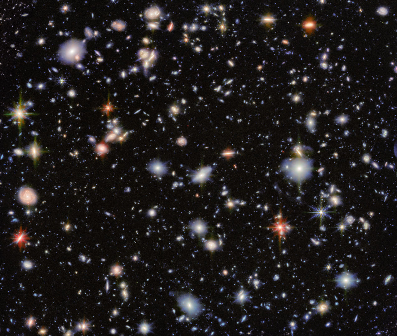 Stars, galaxies and you –&nbsp;all this exists because matter won out over antimatter at the beginning of time. Credit: ESA/Webb, NASA & CSA, G. Östlin, P. G. Perez-Gonzalez, J. Melinder, the JADES Collaboration, the MIDIS collaboration, M. Zamani (ESA/Webb)