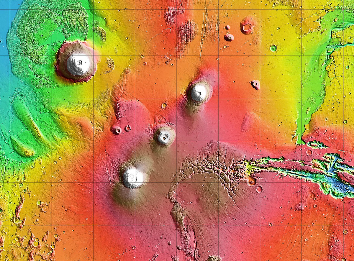 Arsia Mons is the southernmost of the three volcanoes that make up Tharsis Montes, shown in the center of this cropped topographic map of Mars. Olympus Mons, the solar system’s largest volcano, is at upper left. The western end of Valles Marineris begins cutting its wide swath across the planet at lower right. Credit: NASA/JPL-Caltech