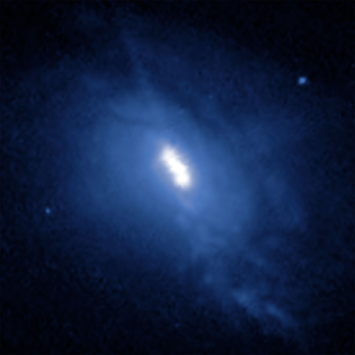 Hubble Space Telescope image of galaxy merger MCG-03-34-064. Three bright dots can be seen. Two are colliding supermassive black holes and the third is a blob of gas. Credit: NASA, ESA, Anna Trindade Falcão (CfA); Image Processing: Joseph DePasquale (STScI)