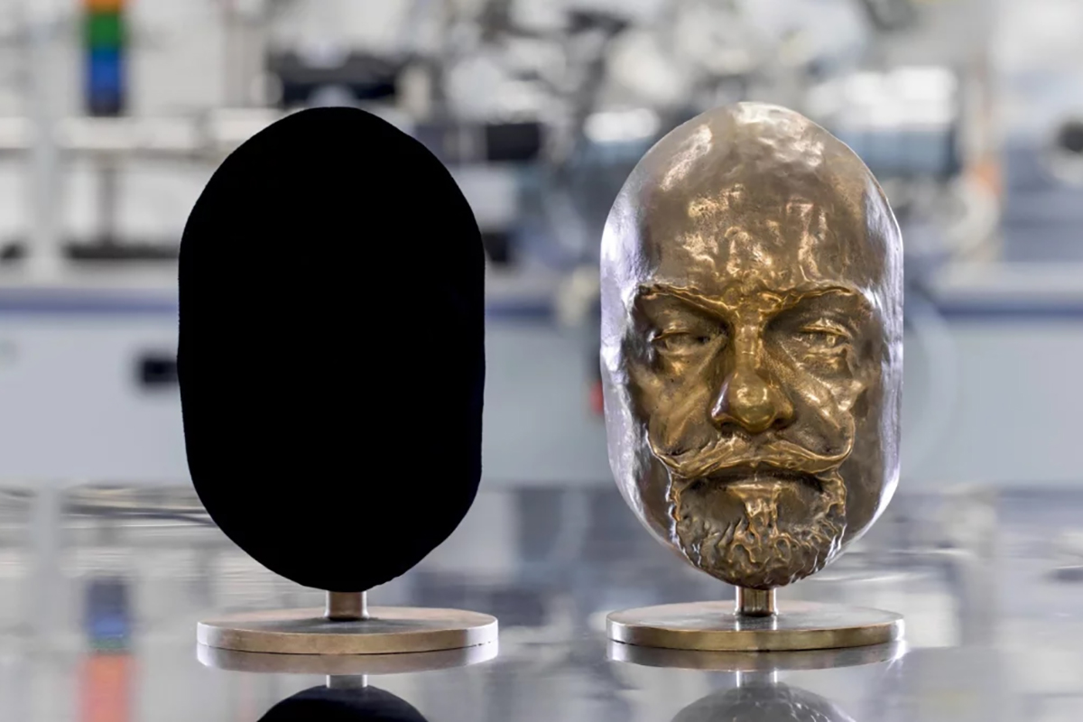 The bronze cast on the left is coated with Vantablack 310, a paint that could help dim bright satellites if space tests prove successful. Credit: Surrey NanoSystems